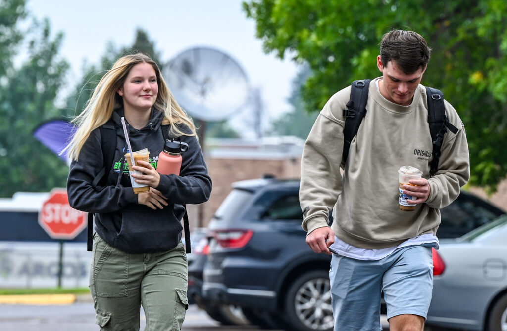 Photo of students walking in the parking lot