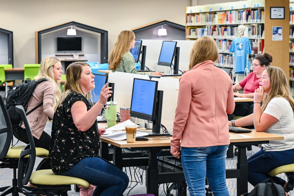 Photo of students studying in the library