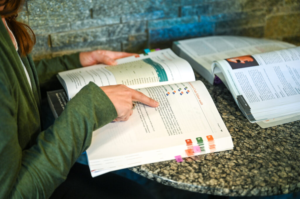 HICS student reading textbook