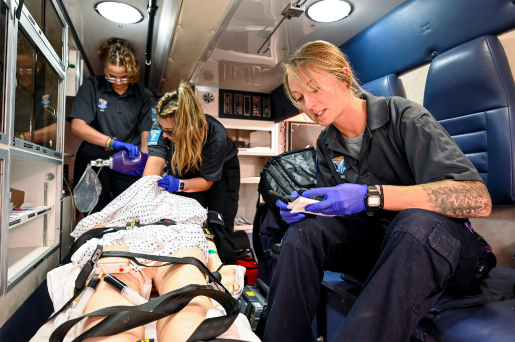 Photo of students in simulated ambulance classroom.