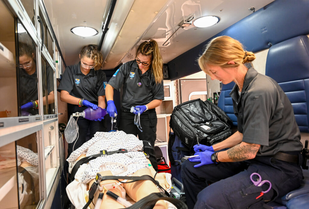 Photo of students in simulated ambulance classroom.